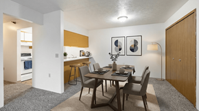 Radcliff apartment for rent - A dining room with a table set for two and a kitchen area in the background.