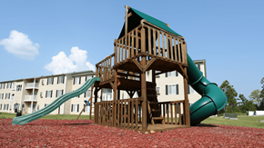 Radcliff apartment for rent - A wooden playground structure with a green slide.