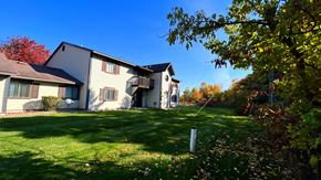 Kinde apartment for rent - a large house with a yard in front of it