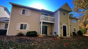 Lapeer apartment for rent - the front of a house with a yard and a deck
