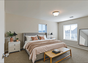 St. Clair apartment for rent - A bedroom with a bed, nightstand, and a plant.