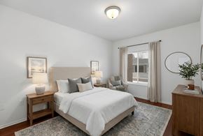 Dundee apartment for rent - A bedroom with a large bed and a window with curtains.