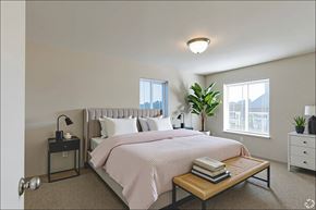 Toledo apartment for rent - A bedroom with a large bed and a window with blinds.