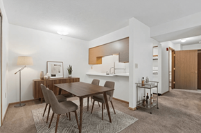 Coldwater apartment for rent - A modern dining room with a wooden table and chairs.
