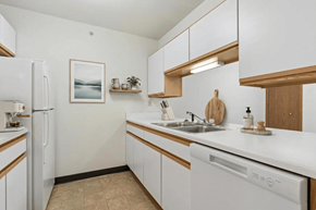 Coldwater apartment for rent - A kitchen with white appliances and wooden accents.