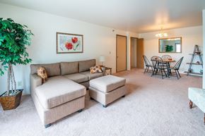 Monroe apartment for rent - Living Room With Kitchen at Custer Estates Apartments, Michigan