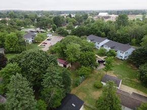 Gladwin apartment for rent - an aerial view of a neighborhood with houses and trees