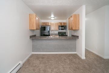 Dewitt apartment for rent - a kitchen with a counter and a microwave and cabinets