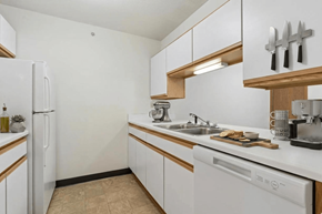 Somerset apartment for rent - A kitchen with white appliances and wooden accents.
