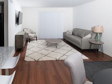 St. Clair apartment for rent - a living room with a couch and a table
