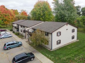 Caledonia apartment for rent - an aerial view of a white house and a parking lot
