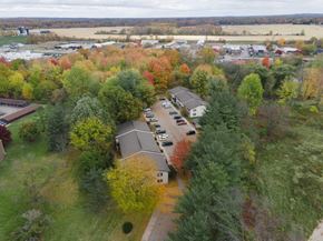 Caledonia apartment for rent - an aerial view of a neighborhood with houses and trees