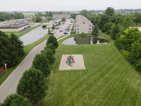 Cicero apartment for rent - an aerial view of a park with a pond and buildings