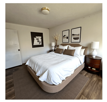 Linden apartment for rent - A bedroom with a large bed and two framed pictures on the wall.