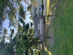 Bloomingdale apartment for rent - a house with a sign on the side of a field