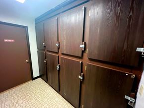 Mackinaw City apartment for rent - a row of wooden elevators in a building with doors