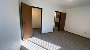 Elkton apartment for rent - a living room with a door to a bathroom and a closet