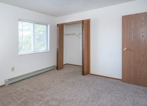 Ubly apartment for rent - an empty bedroom with a closet and a window