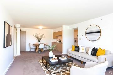 Hopkinsville apartment for rent - A living room with a white couch and a coffee table.