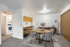 Kendallville apartment for rent - A dining room with a round table and grey chairs.