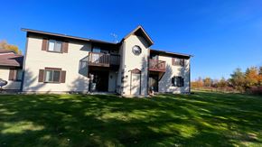 Kinde apartment for rent - a large house with a yard in front of it