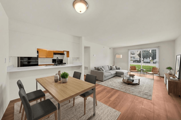 Manchester apartment for rent - A modern living room with a dining table and chairs.
