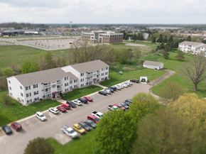 Howell apartment for rent - an aerial view of an apartment building and parking lot