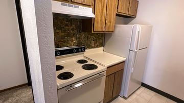 Kingston apartment for rent - a kitchen with a stove and a refrigerator