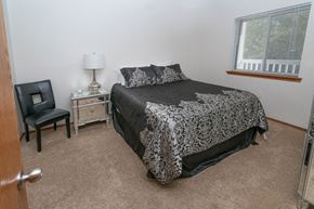 East Lansing apartment for rent - Spacious Bedroom With Comfortable Bed at Raleigh House Apartments, MRD Apartments, East Lansing, 48823