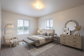 Sturgis apartment for rent - A well-lit bedroom with a large bed, a chair, and a bench.