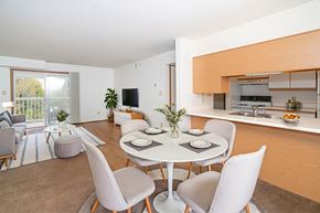 Grandview Plaza apartment for rent - A modern dining room with a white table and chairs.