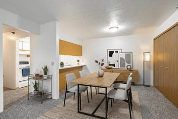 Adrian apartment for rent - A dining room with a table and chairs.