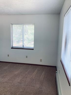 Concord apartment for rent - an empty room with a window and a carpet