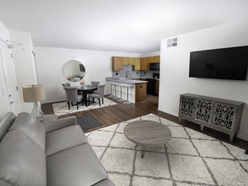 Waterville apartment for rent - A living room with a grey couch and a wooden coffee table.