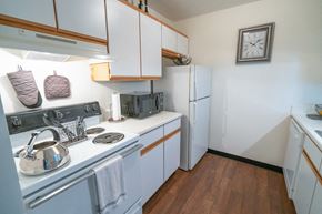 Lebanon apartment for rent - a kitchen with white appliances and white cabinets and a white refrigerator