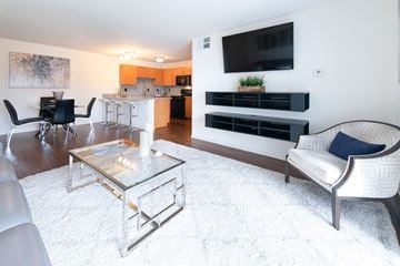 Perrysburg apartment for rent - a living room with a couch and a table and a television