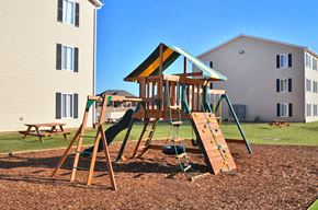 Lawton apartment for rent - Tot Lot And Playing Field at Ross Estates Apartments, MRD Conventional, Lawton, OK