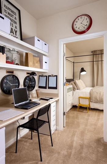 Built-in home office computer center with overhead library shelving