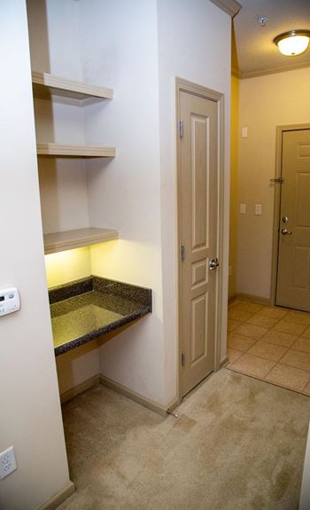 Built-in home office area with overhead shelving in select apartment homes