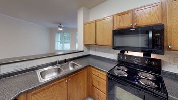 Oak cabinets, energy efficient appliances and breakfast bar
