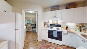 Smyrna apartment for rent - A kitchen with white appliances and cabinets.