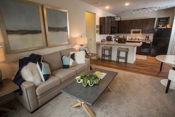 Marietta apartment for rent - A modern living room with a grey couch and a grey coffee table.