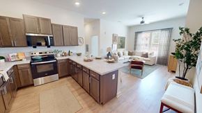Norcross apartment for rent - A kitchen with a stove top oven and a refrigerator.