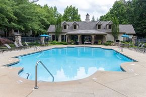 Roswell apartment for rent - a resort style pool with a house in the background