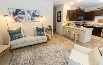Augusta apartment for rent - a living room with a couch and a kitchen