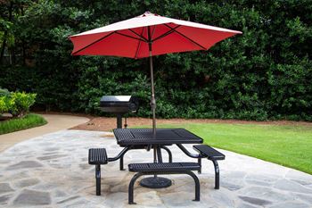 Picnic areas with tables, grills and swings