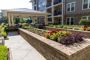 Beautifully landscaped courtyard with sitting areas (click for video))