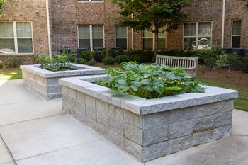 Beautifully landscaped courtyard with sitting areas (click for video))