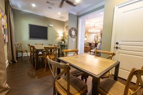 Marietta apartment for rent - a dining room with tables and chairs and a tv on the wall