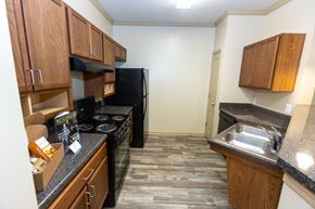 Augusta apartment for rent - a kitchen with a stove a sink and a refrigerator